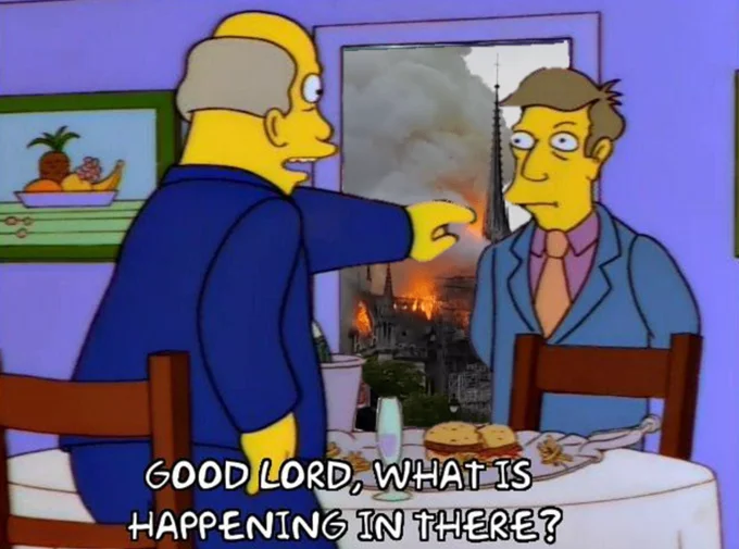 A remix of the 'This Is Fine' meme featuring Quasimodo, referencing the Notre-Dame fire.