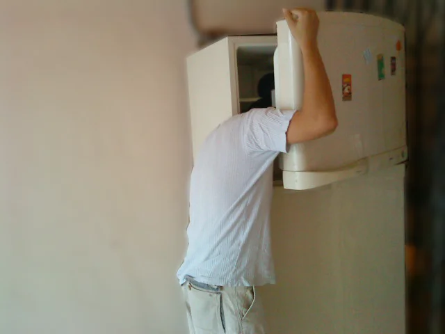 Vintage appliance: head in old freezer.