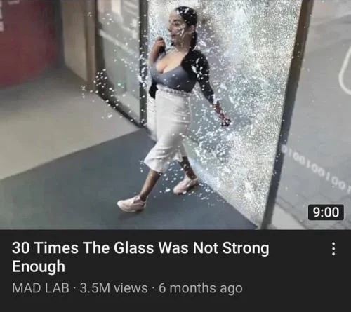 The source: woman breaking through glass door.