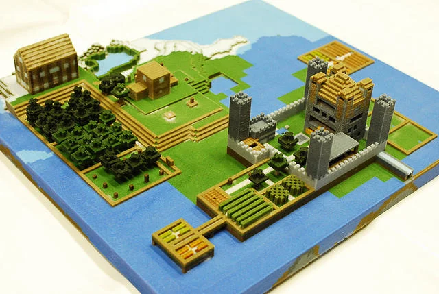 A 3D-printed diorama of a Minecraft world, illustrating how the technology enables players to bring virtual creations into physical form.