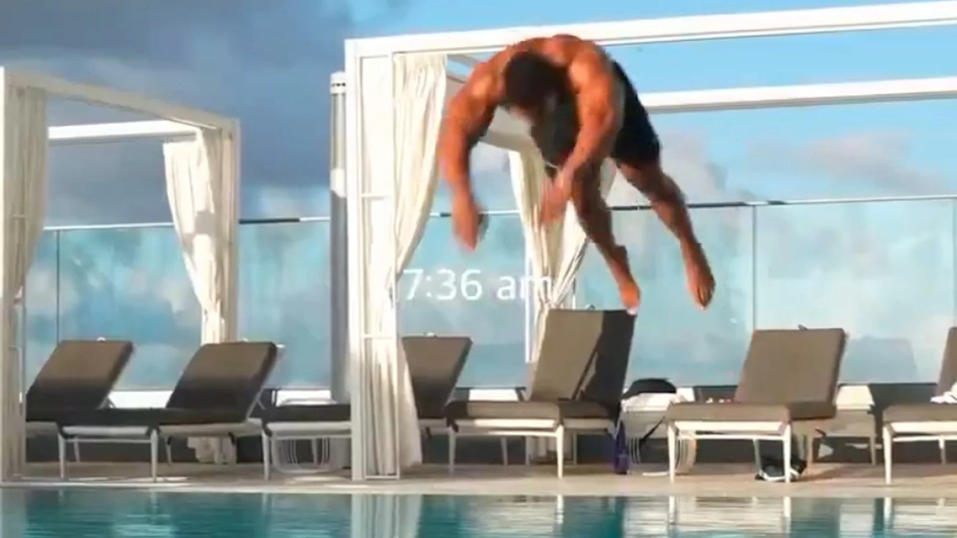 The original viral video still of the man captured mid-dive at 7:36 am, whose bizarre frozen pose sparked the meme.