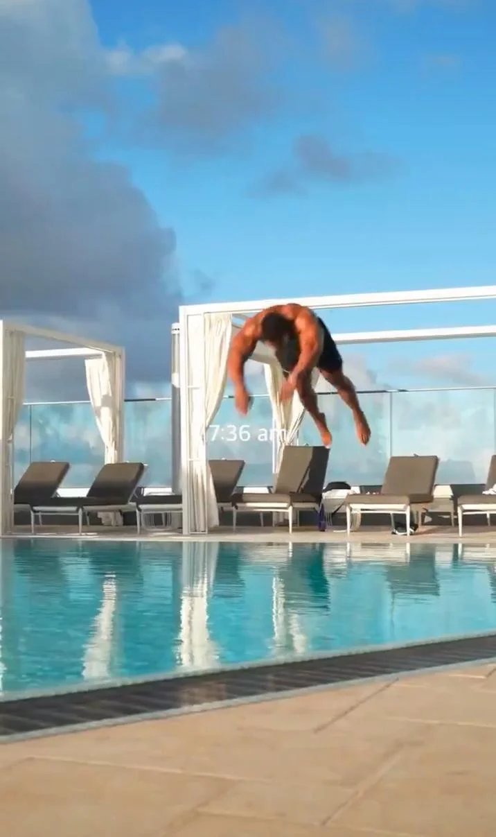 A vertical portrait crop of the original TikTok-style video showing the diver frozen mid-motion at 7:36 am.