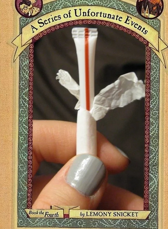 One of the earliest and most iconic entries in the 'A Series of Unfortunate Events cover parodies' meme, replacing the original book art with a photo of a razor and torn tissue.
