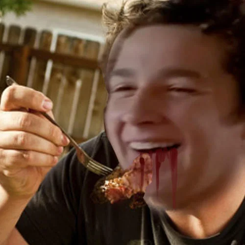 An edited image of Shia LaBeouf enjoying a bloody piece of meat, playing on his 'actual cannibal' reputation.