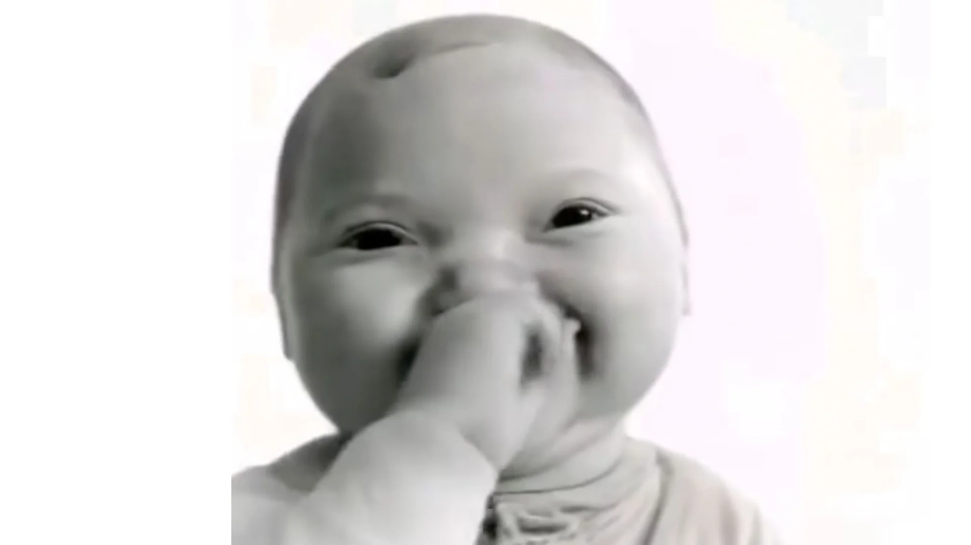 The original AI Baby Holding Laugh image that became a viral reaction meme in 2025.