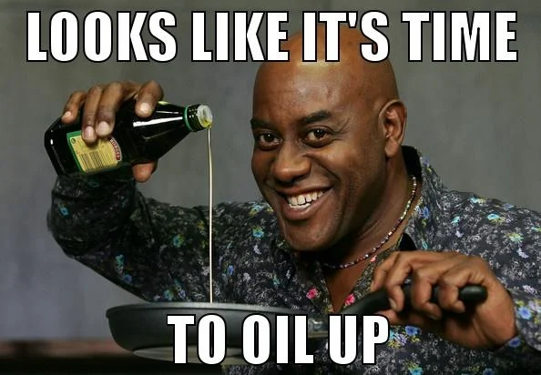 The classic 'Looks like it's time to oil up' image macro that helped popularize Ainsley Harriott as an internet meme.