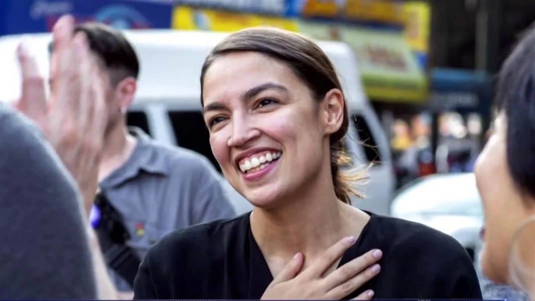 Alexandria Ocasio-Cortez celebrates with supporters after her upset primary win in New York's 14th congressional district in June 2018.