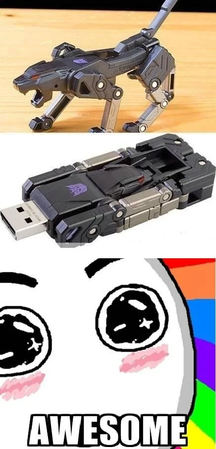 The Amazed Face reacting with 'AWESOME' to a Transformers Decepticon USB drive that converts between robot and vehicle modes.