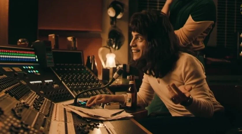 The source screenshot from Bohemian Rhapsody (2018) that became the base template for the 'And this is where the operatic section comes in' meme.