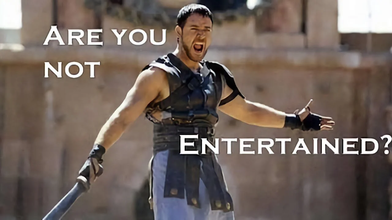 The iconic scene from Gladiator (2000) where Maximus shouts 'Are you not entertained?' at the arena crowd, which became the basis for the meme.