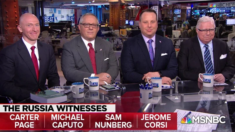 The original MSNBC 'The Beat with Ari Melber' segment featuring four key Russiagate witnesses — Carter Page, Michael Caputo, Sam Nunberg and Jerome Corsi — seated together at the news desk.
