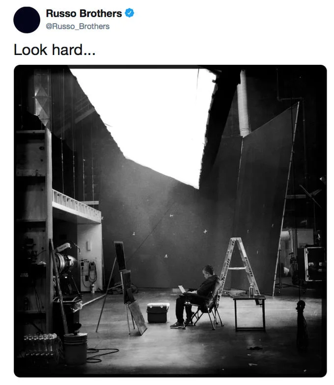 A Russo Brothers tweet teasing the wrap of Avengers: Endgame with a moody behind-the-scenes soundstage image.