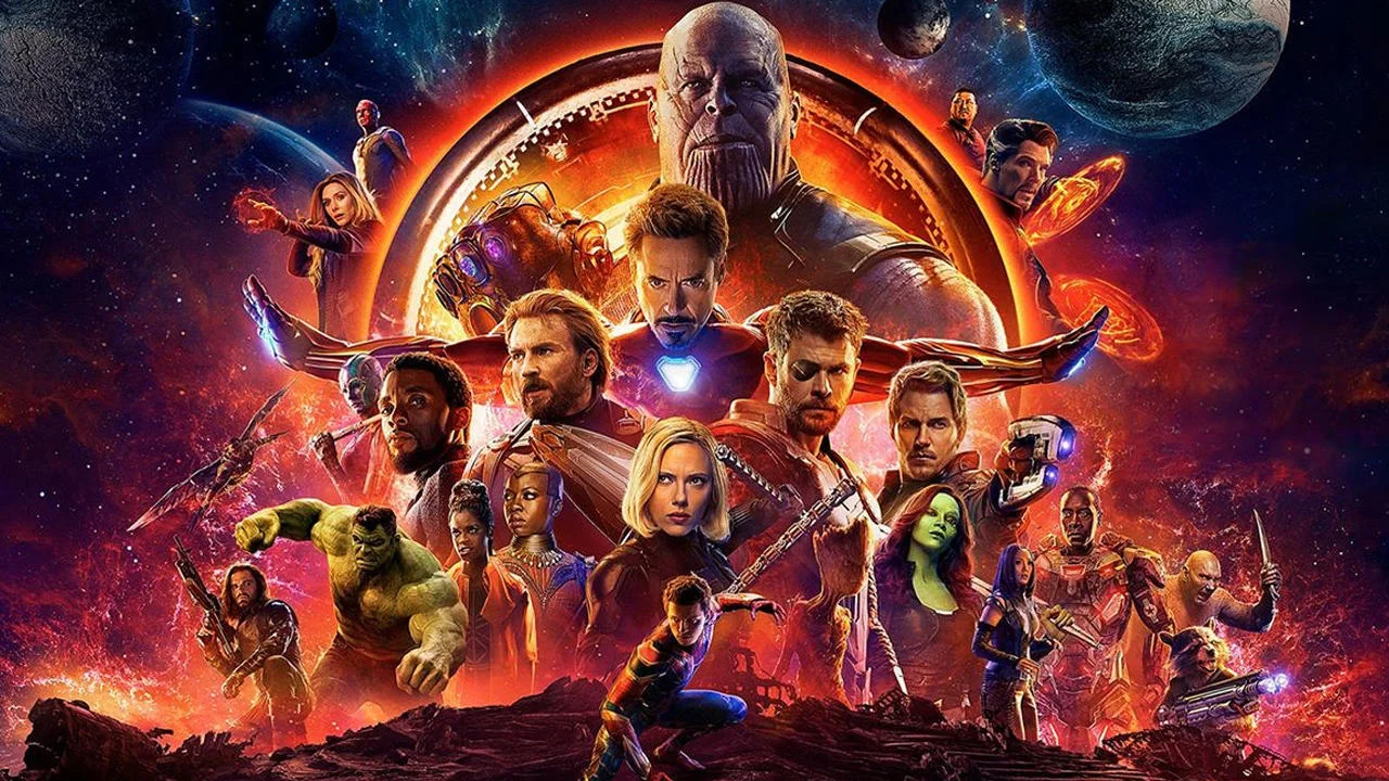 The official theatrical poster for Marvel's Avengers: Infinity War (2018), depicting the film's massive ensemble cast beneath the villain Thanos.