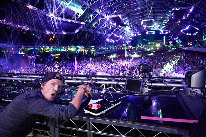 Avicii performing live at a festival, one of many sold-out shows during his career as a globally renowned electronic dance music DJ.