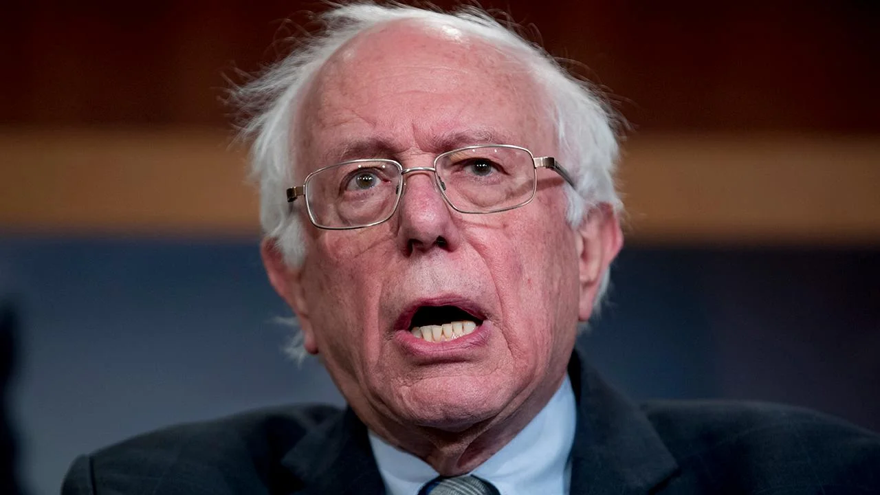 Senator Bernie Sanders speaking at a press conference, the widely-used portrait associated with his political career and internet presence.