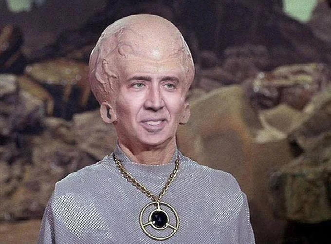 A popular photoshop remix pasting Nicolas Cage's face onto the Talosian body, a common variant of the Big Brain Alien meme.