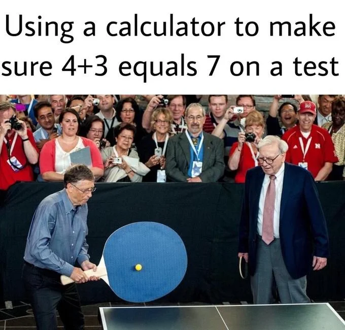 A wider crop of the source image showing the crowd's amused reaction as Bill Gates plays table tennis with an absurdly large paddle against Warren Buffett.