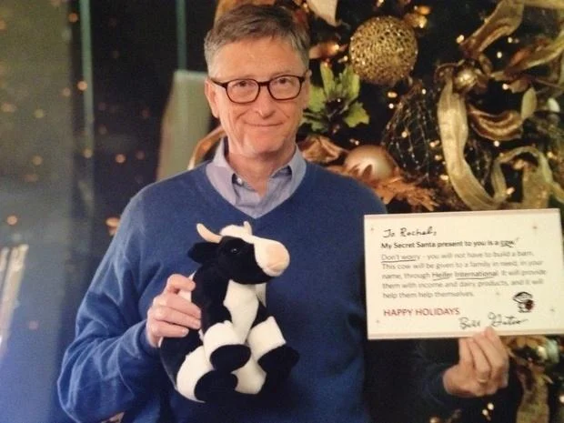 Bill Gates as a Reddit Secret Santa, gifting a plush cow along with a Heifer International donation.