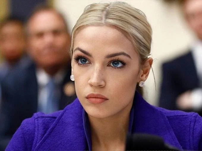 A cropped close-up of the viral Blonde AOC image used throughout the meme's spread.
