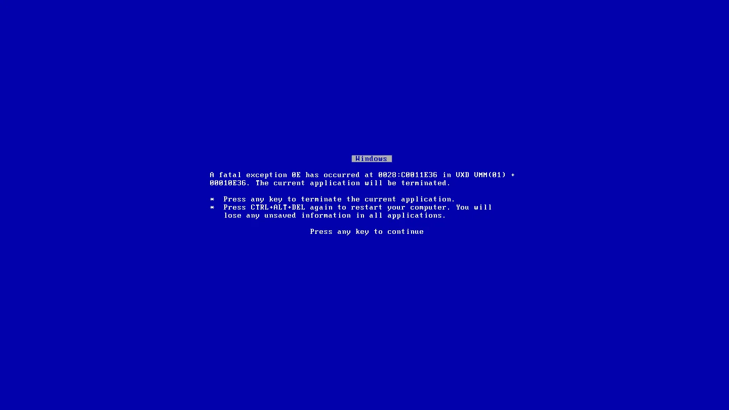 The iconic Windows 9x Blue Screen of Death, showing a fatal exception error prompting the user to press a key or restart the computer.