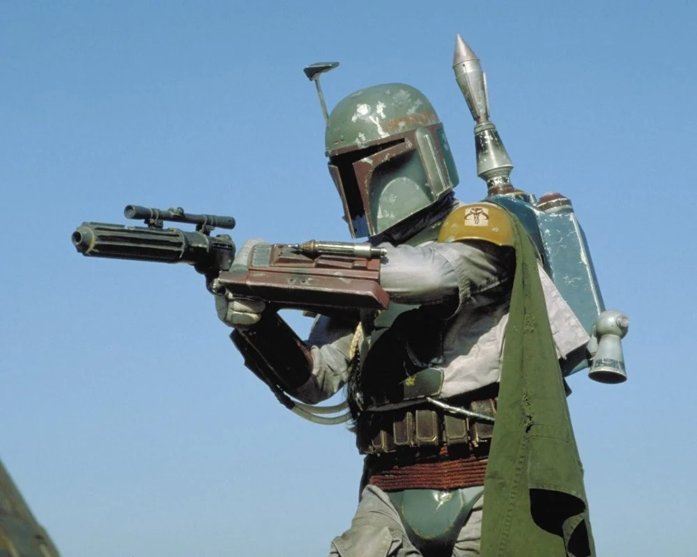 Boba Fett, the legendary bounty hunter, wielding his signature EE-3 carbine blaster in Return of the Jedi.