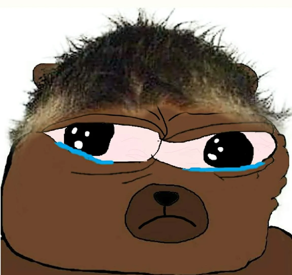 A tightly cropped Bobo The Bear variant with wild unkempt hair and glossy, tear-streaked eyes above a downturned frown.