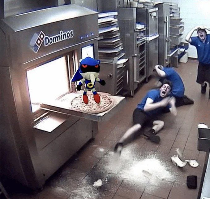 Photoshop edit placing the bootleg Metal Sonic plush riding a pizza in the classic Domino's kitchen freakout image.