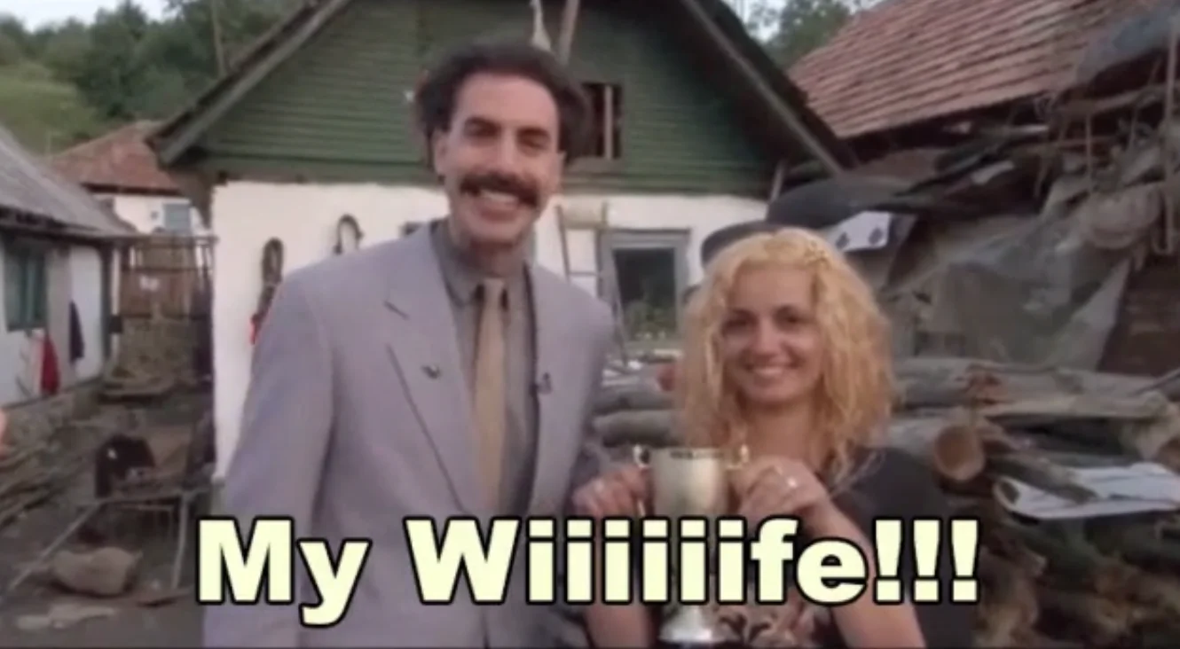 The iconic scene from the 2006 film 'Borat' where the character exclaims 'My Wiiiiiife!!!', the source of the meme's catchphrase.