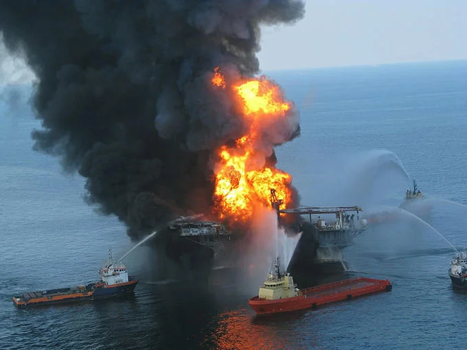The Deepwater Horizon offshore drilling rig burns in the Gulf of Mexico in April 2010, the event that triggered the largest marine oil spill in U.S. history.