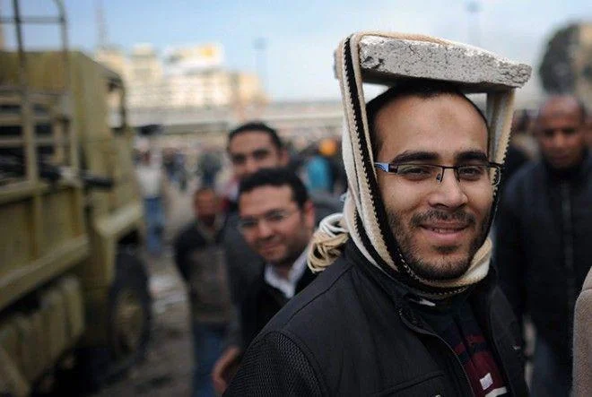 Related Arab Spring protester with improvised headgear.
