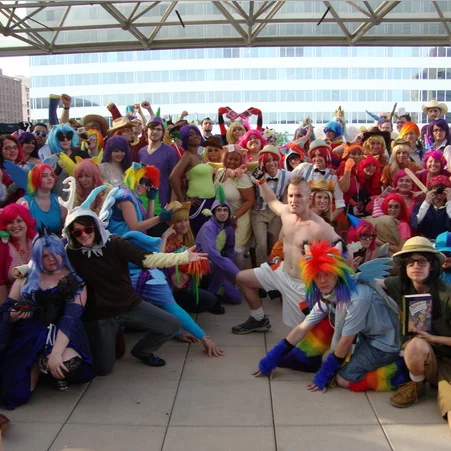 Bronies gather in full My Little Pony cosplay at a fan convention meetup.