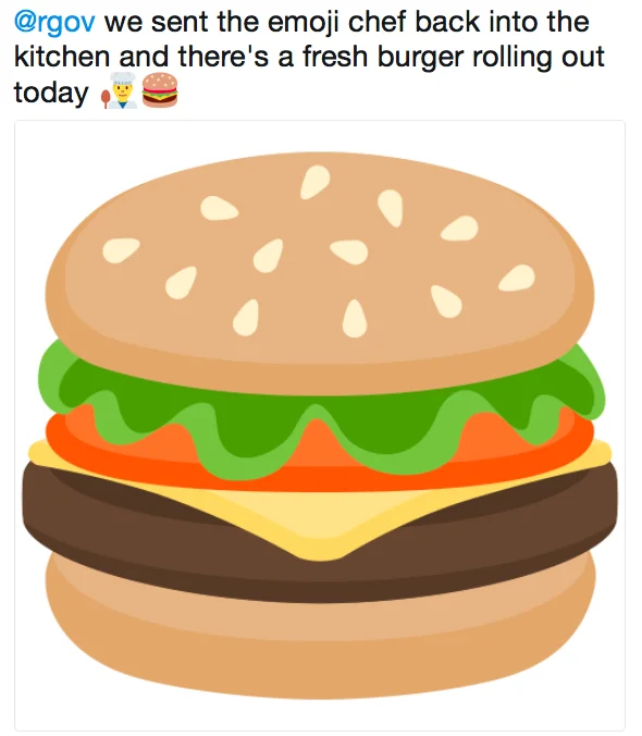 Google's revised burger emoji, unveiled after the debate, with the cheese now correctly placed on top of the patty.