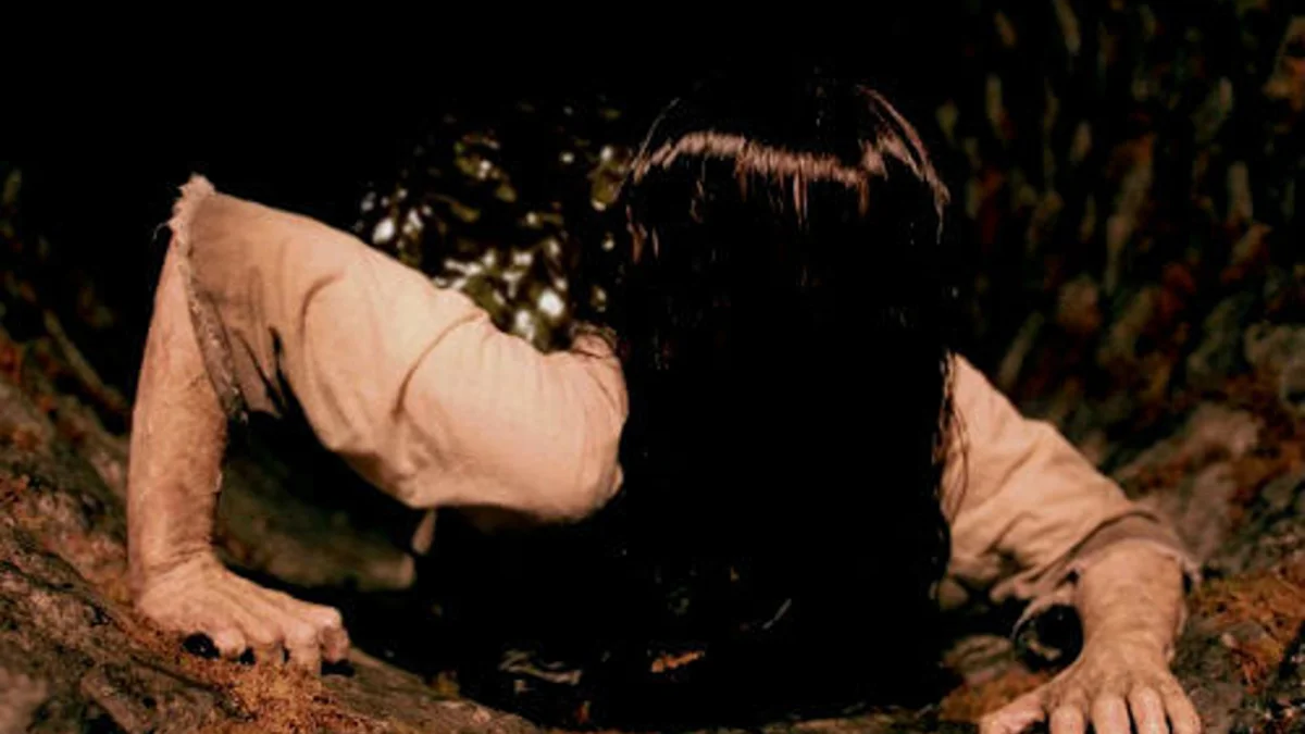 The iconic image commonly associated with the Carmen Winstead chain letter, depicting a ghost-like figure emerging from a sewer.