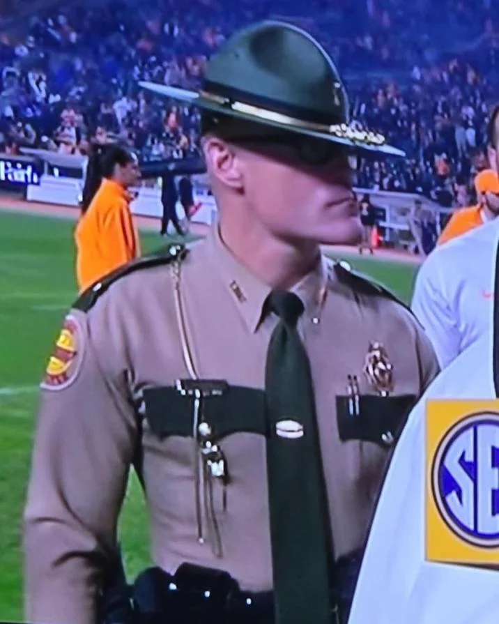 The stoic state trooper in his full Tennessee Highway Patrol uniform, an image that fueled the 'Cassius Thundercock' meme.