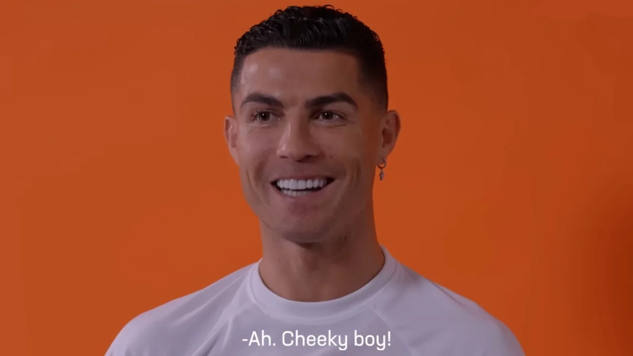 Screenshot from the viral Cristiano Ronaldo interview in which he laughs and says 'Ah. Cheeky boy!', the moment that became the basis of the meme.