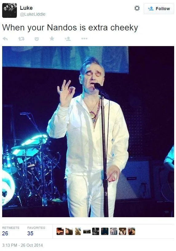 A 2014 tweet applying the 'extra cheeky' caption to Morrissey mid-performance, one of many celebrity reaction variants of the meme.