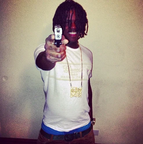 Chief Keef direct camera pointing portrait.
