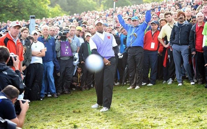 The original Mark Pain photo from the 2010 Ryder Cup where the Cigar Guy was first spotted in the gallery behind Tiger Woods.
