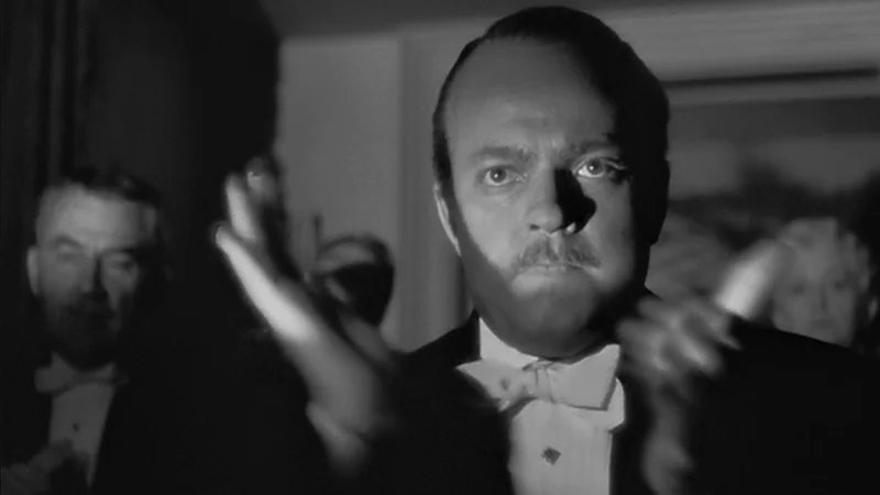 The iconic still of Charles Foster Kane clapping from Orson Welles' Citizen Kane (1941), the source image for the meme.