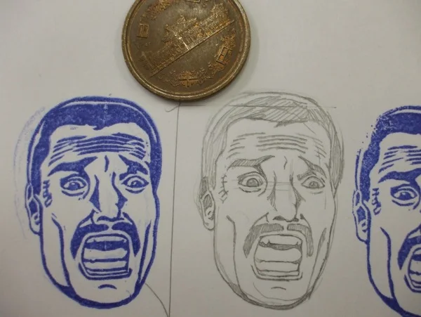 A fan-crafted hanko-style rubber stamp of Bennett's screaming face, illustrating how deeply the Commando meme has embedded itself in Japanese fan culture.