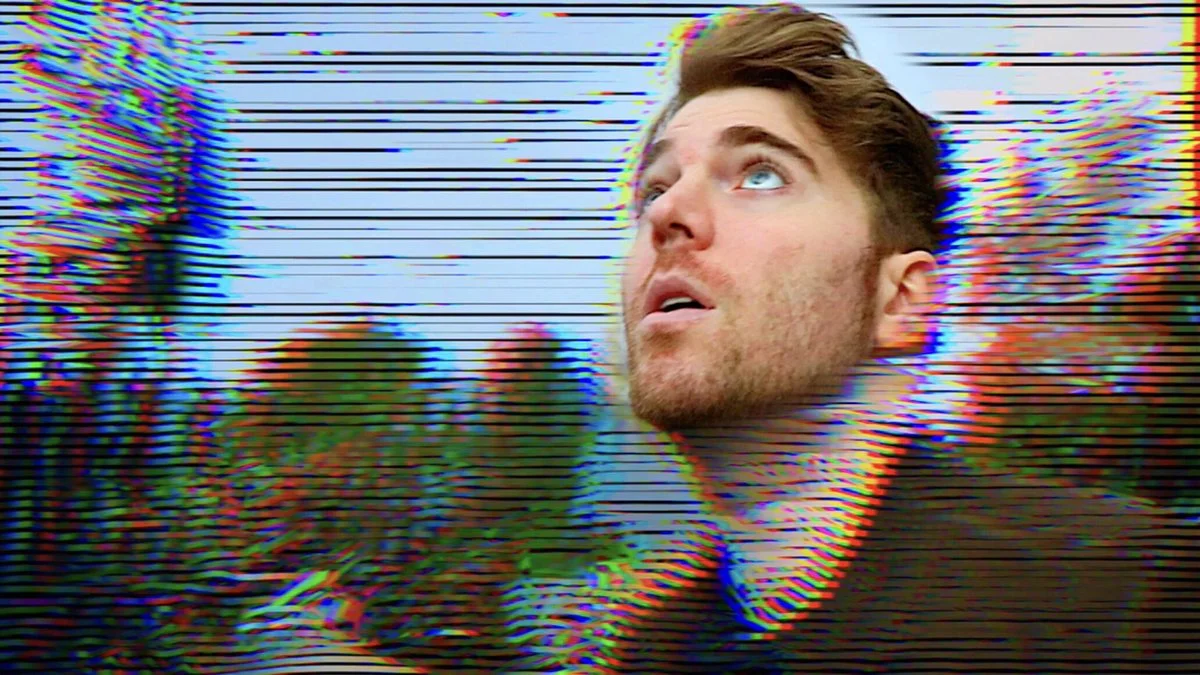 The signature thumbnail imagery from Shane Dawson's Conspiracy Series, featuring his shocked expression over a distorted VHS effect.