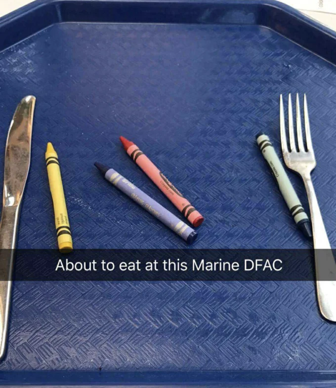 A Snapchat-style photo joking about a Marine dining hall serving crayons alongside utensils.