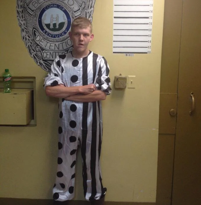 A booking photograph of a suspect arrested in Kentucky while wearing a clown costume during the 2016 creepy clown craze.