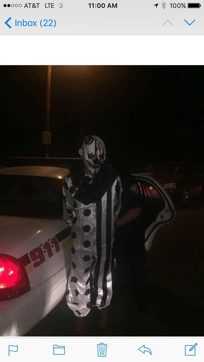 A mobile screenshot capturing the arrest of a creepy clown suspect apprehended by police during the 2016 sightings.