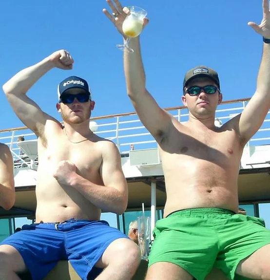 The widely circulated photo of two men on a cruise ship that became a defining visual example of the 'dad bod' aesthetic.