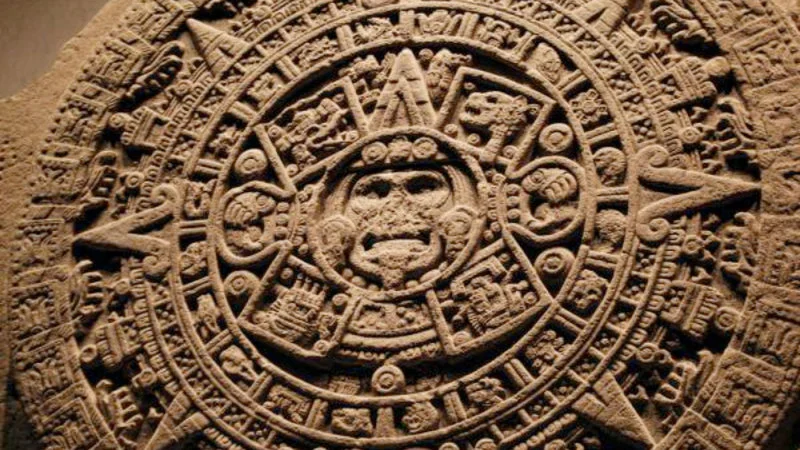 The Aztec Sun Stone, visual shorthand for 2012 doomsday narrative.