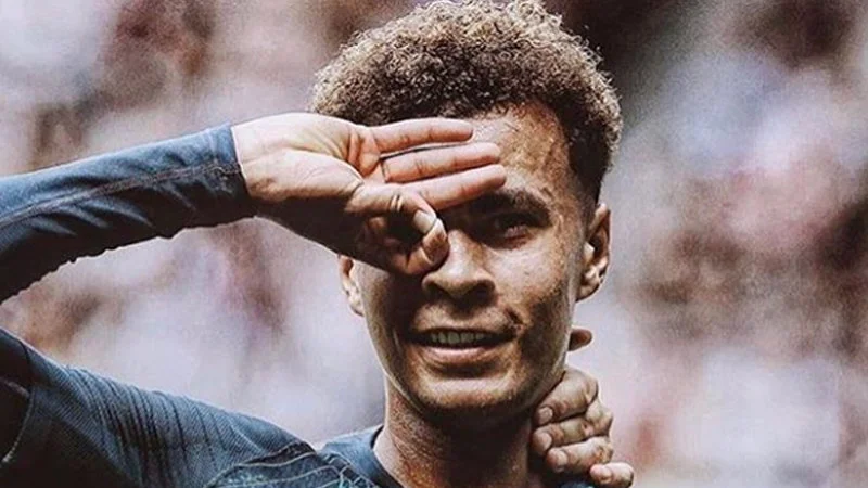 The iconic Dele Alli hand celebration gesture.
