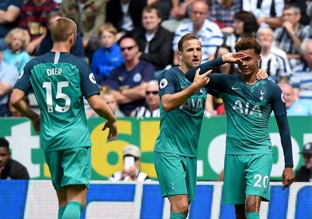 Tottenham team celebration on field with Dele Alli.