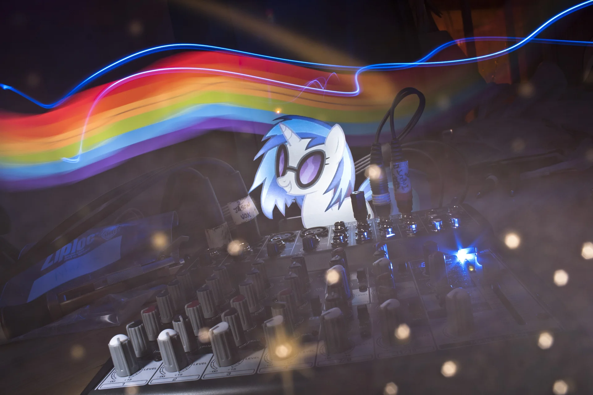 Bronies at a convention displaying fan-made Vinyl Scratch merchandise, including a plush figure and signed artwork.
