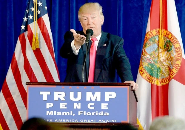 Donald Trump addresses the crowd at a Trump-Pence campaign event in Miami, Florida, during the 2016 presidential race.